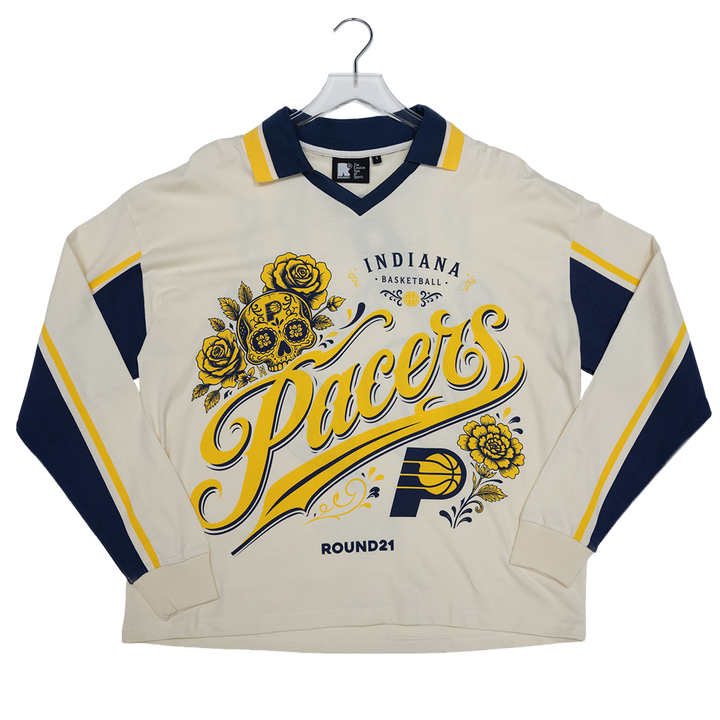 A vintage-style Indiana Pacers long-sleeve basketball jersey in cream, navy, and yellow, displayed on a hanger against a white background.