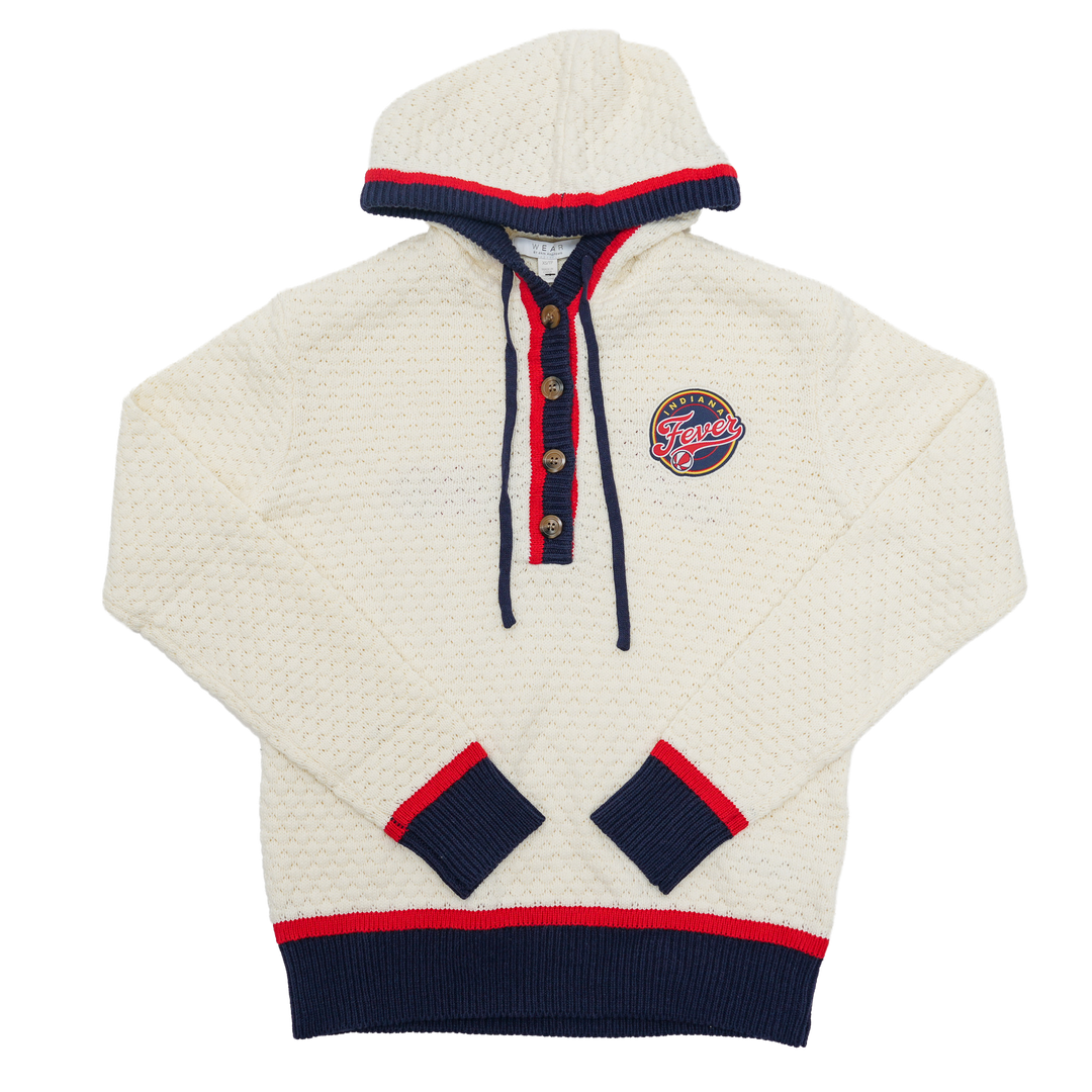 White sweater with navy and red accents on a white background