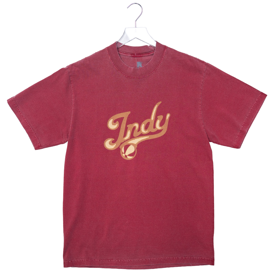 Red t-shirt with 'Indy' printed in gold on a white background