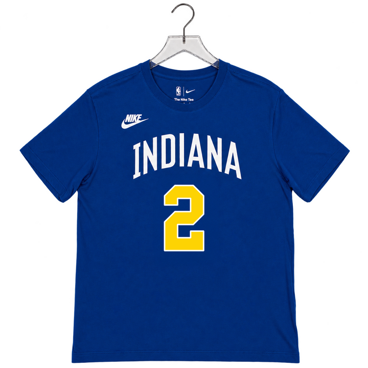 A royal blue short-sleeve Nike basketball T-shirt hanging on a clear plastic hanger against a white background. The shirt features &