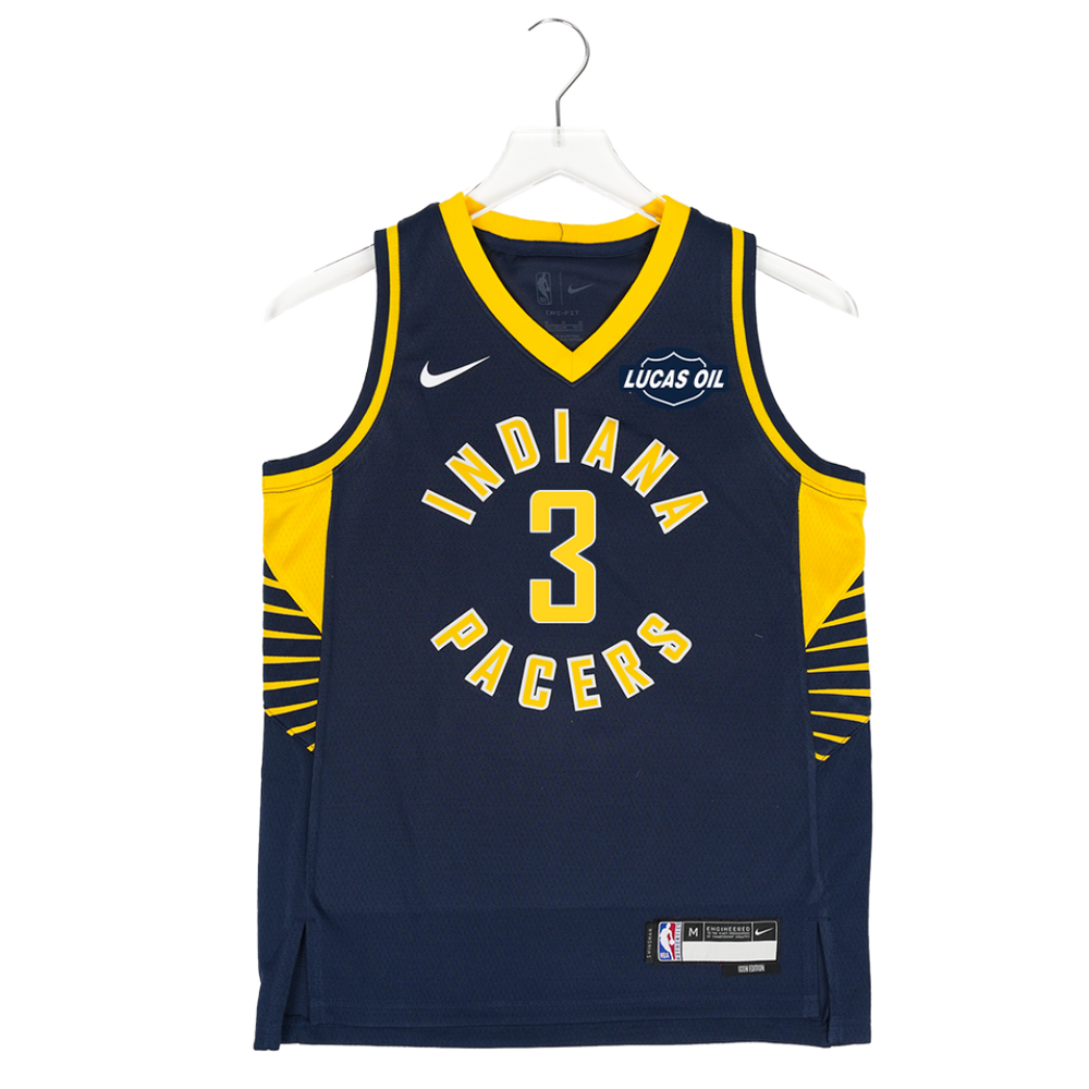 Navy blue basketball jersey with yellow accents on a hanger