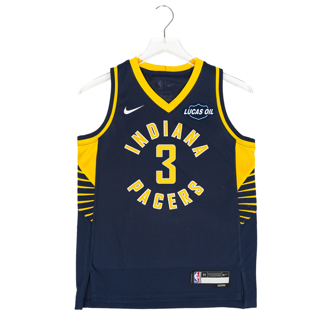 Navy blue basketball jersey with yellow accents on a hanger