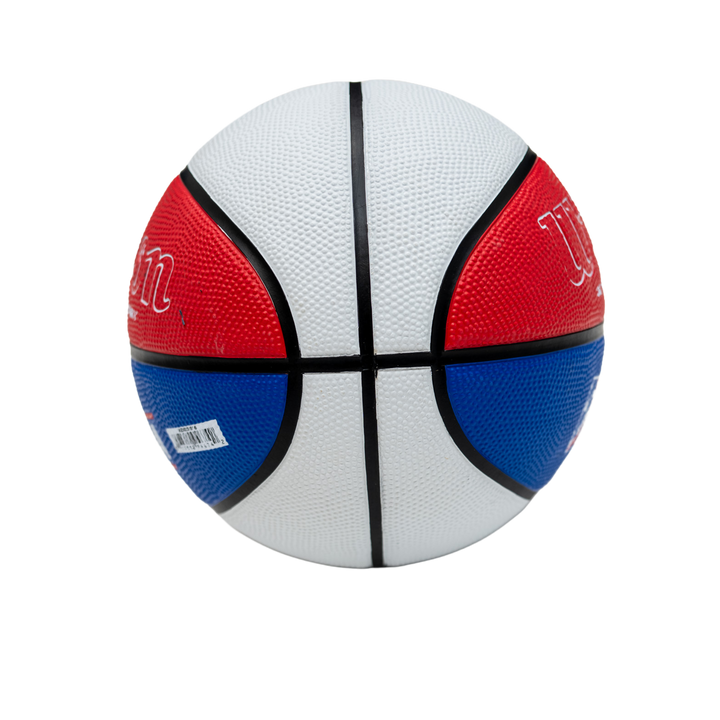 Basketball with red, white, and blue panels on a white background