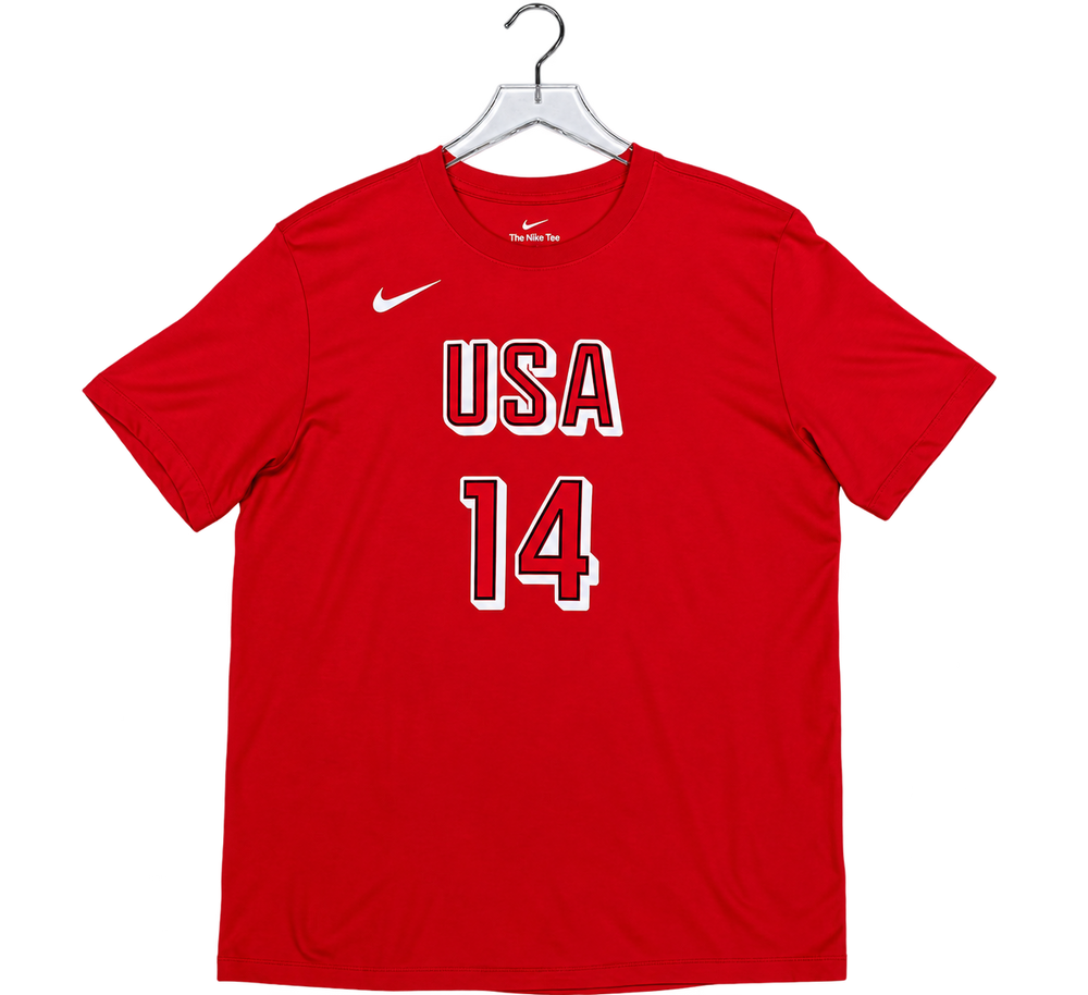 A red short-sleeve athletic T-shirt hanging on a clear plastic hanger against a white background. The shirt features a white Nike swoosh on the left chest and 'USA 14' printed in white with a red outline on the front.