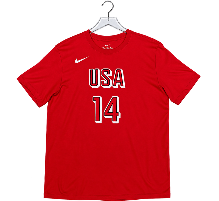 A red short-sleeve athletic T-shirt hanging on a clear plastic hanger against a white background. The shirt features a white Nike swoosh on the left chest and 'USA 14' printed in white with a red outline on the front.