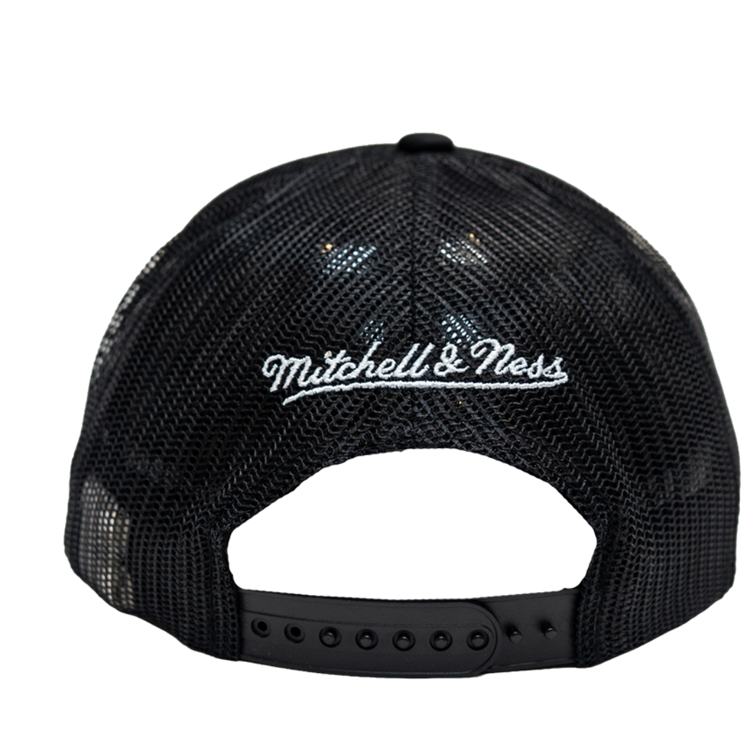 Black mesh back trucker cap with white embroidered 'Mitchell & Ness' logo on the front, shown from the back against a white background.
