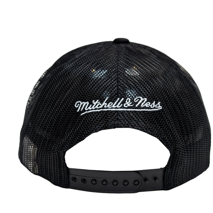 Black mesh back trucker cap with white embroidered 'Mitchell & Ness' logo on the front, shown from the back against a white background.