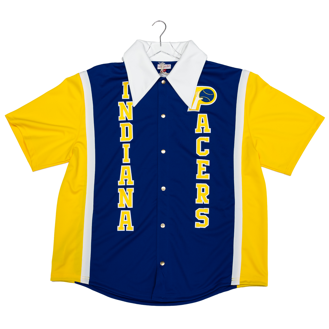 Indiana Pacers short-sleeve button-up jersey shirt in navy blue, yellow, and white, displayed on a hanger against a white background.