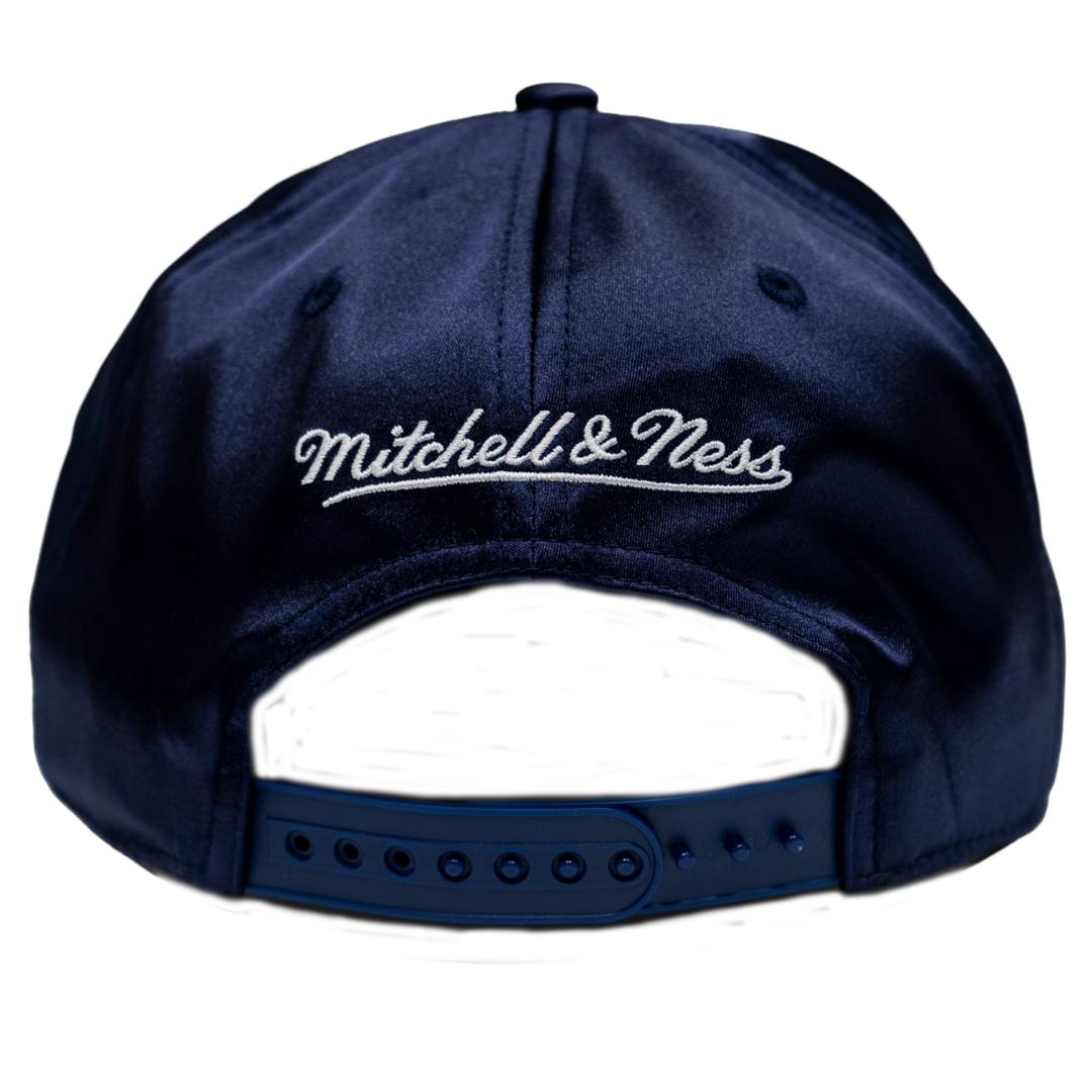 Navy blue cap with 'Mitchell & Ness' logo on a white background