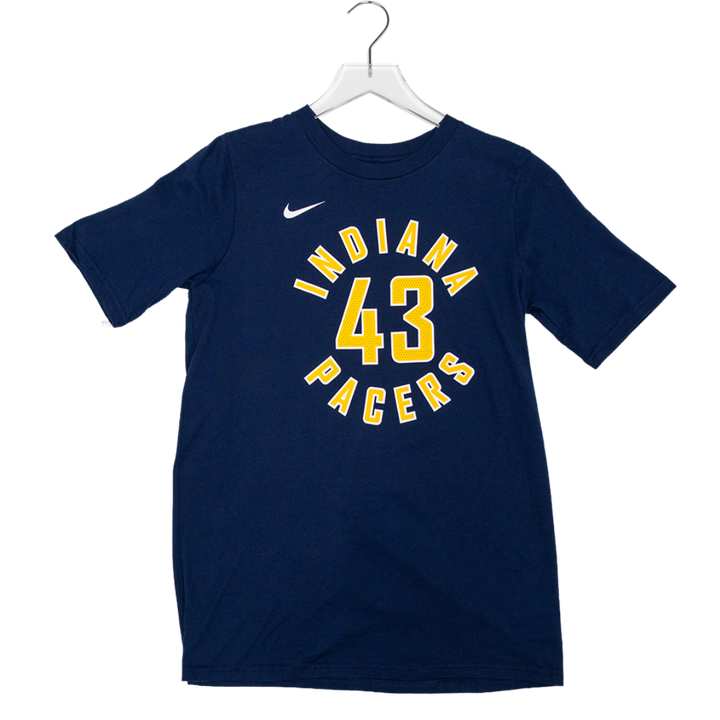 A navy blue short-sleeve t-shirt hanging on a white plastic hanger against a white background. The shirt features a yellow and white graphic on the front with the text 'INDIANA 43 PACERS' and a small white Nike swoosh logo on the left chest.
